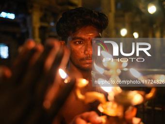 A Hindu devotee offers a prayer for Diwali at the Sri Ponnambala Vaneswarar Hindu temple in Colombo, Sri Lanka, on October 31, 2024. Diwali,...