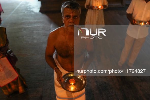 A Hindu devotee offers a prayer for Diwali at the Sri Ponnambala Vaneswarar Hindu temple in Colombo, Sri Lanka, on October 31, 2024. Diwali,...