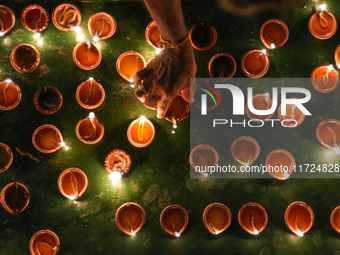 Hindu devotees light oil lamps to celebrate Diwali at the Sri Ponnambala Vaneswarar Hindu temple in Colombo, Sri Lanka, on October 31, 2024....