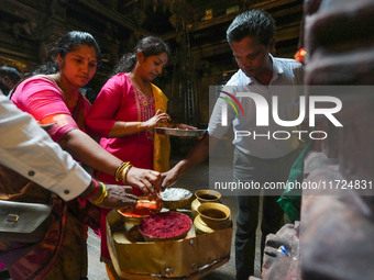 Hindu devotees take the holy ash, known as Vibhuti, Bhasma (Sanskrit), or Thiruneeru (Tamil), to celebrate Diwali at the Sri Ponnambala Vane...