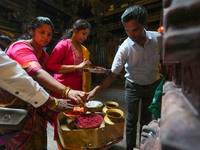 Hindu devotees take the holy ash, known as Vibhuti, Bhasma (Sanskrit), or Thiruneeru (Tamil), to celebrate Diwali at the Sri Ponnambala Vane...