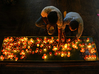 Hindu devotees light oil lamps to celebrate Diwali at the Sri Ponnambala Vaneswarar Hindu temple in Colombo, Sri Lanka, on October 31, 2024....