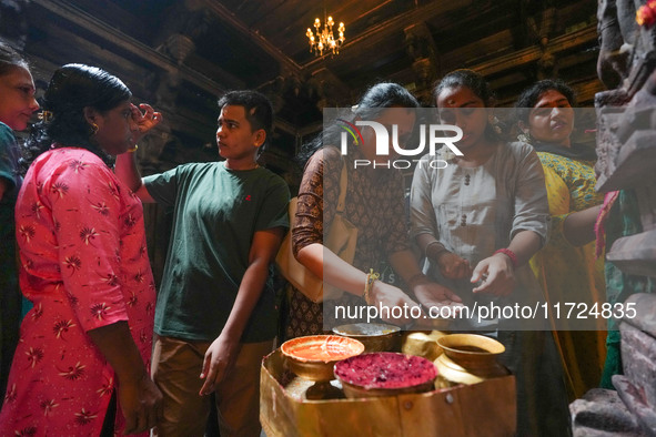 Hindu devotees take the holy ash, known as Vibhuti, Bhasma (Sanskrit), or Thiruneeru (Tamil), to celebrate Diwali at the Sri Ponnambala Vane...