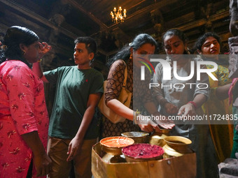 Hindu devotees take the holy ash, known as Vibhuti, Bhasma (Sanskrit), or Thiruneeru (Tamil), to celebrate Diwali at the Sri Ponnambala Vane...