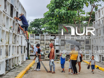 Filipinos visit the graves of their loved ones in Rizal, Philippines, on October 31, 2024. Undas, a unique occasion observed by Filipinos, d...