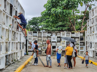 Filipinos visit the graves of their loved ones in Rizal, Philippines, on October 31, 2024. Undas, a unique occasion observed by Filipinos, d...