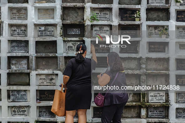 Filipinos visit the graves of their loved ones in Rizal, Philippines, on October 31, 2024. Undas, a unique occasion observed by Filipinos, d...