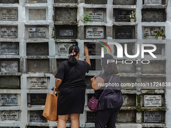 Filipinos visit the graves of their loved ones in Rizal, Philippines, on October 31, 2024. Undas, a unique occasion observed by Filipinos, d...