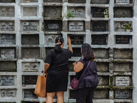 Filipinos visit the graves of their loved ones in Rizal, Philippines, on October 31, 2024. Undas, a unique occasion observed by Filipinos, d...