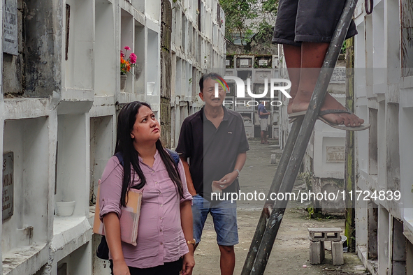 Filipinos visit the graves of their loved ones in Rizal, Philippines, on October 31, 2024. Undas, a unique occasion observed by Filipinos, d...