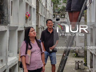 Filipinos visit the graves of their loved ones in Rizal, Philippines, on October 31, 2024. Undas, a unique occasion observed by Filipinos, d...