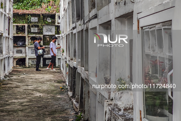 Filipinos visit the graves of their loved ones in Rizal, Philippines, on October 31, 2024. Undas, a unique occasion observed by Filipinos, d...