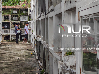 Filipinos visit the graves of their loved ones in Rizal, Philippines, on October 31, 2024. Undas, a unique occasion observed by Filipinos, d...