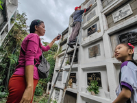 Filipinos visit the graves of their loved ones in Rizal, Philippines, on October 31, 2024. Undas, a unique occasion observed by Filipinos, d...