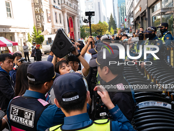 Around 20 members of the Korean University Students' Progressive Union and citizens protest at the People Power Party's central office in Ye...