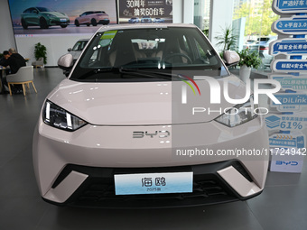 A car is displayed at a BYD 4S shop in Nanjing, China, on October 31, 2024. On October 31, 2024, BYD announces that its operating income in...