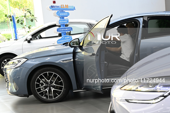 A customer experiences a BYD car at a BYD 4S store in Nanjing, China, on October 31, 2024. On October 31, 2024, BYD announces that its opera...