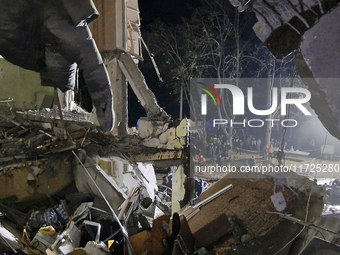 A section of a nine-storey residential building is destroyed by a Russian glide bomb in Kharkiv, Ukraine, on October 31, 2024. An 11-year-ol...