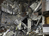 A section of a nine-storey residential building is destroyed by a Russian glide bomb in Kharkiv, Ukraine, on October 31, 2024. An 11-year-ol...