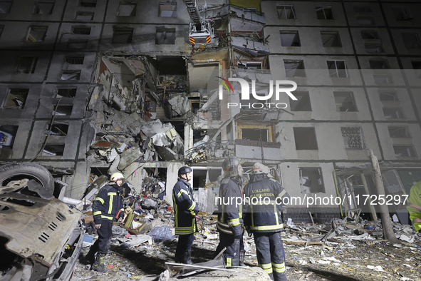 Rescuers work at a section of a nine-storey residential building destroyed by a Russian glide bomb in Kharkiv, Ukraine, on October 31, 2024....