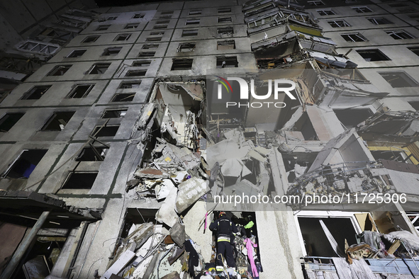 A section of a nine-storey residential building is destroyed by a Russian glide bomb in Kharkiv, Ukraine, on October 31, 2024. An 11-year-ol...