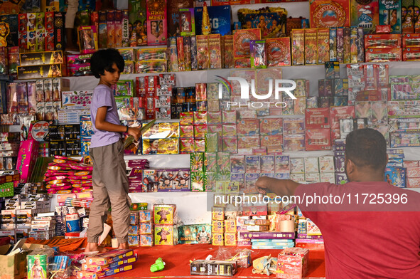 A child buys firecrackers for the Diwali festival, the Hindu festival of lights, in Hyderabad, India, on October 31, 2024 