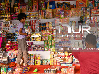 A child buys firecrackers for the Diwali festival, the Hindu festival of lights, in Hyderabad, India, on October 31, 2024 (