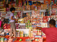 A child buys firecrackers for the Diwali festival, the Hindu festival of lights, in Hyderabad, India, on October 31, 2024 (