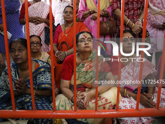 Ridhima Jana, a 9-year-old girl dressed as a Kumari, is worshiped by devotees during rituals to celebrate the Hindu festival of Kali Puja at...