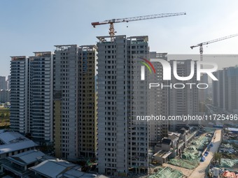 A building under construction by China Overseas Property is for sale in Qingjiangpu district, Huai 'an city, Jiangsu province, on October 31...