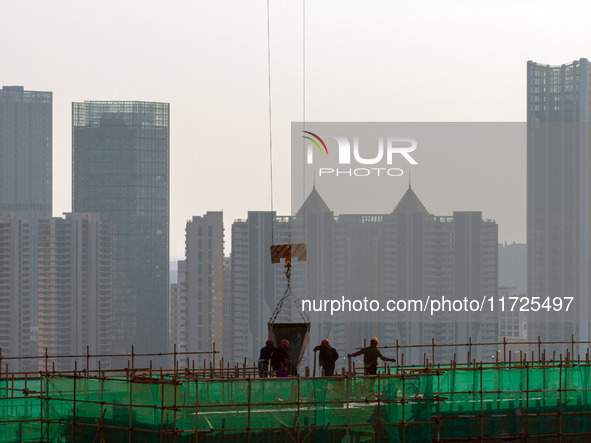 A building under construction by China Overseas Property is for sale in Qingjiangpu district, Huai 'an city, Jiangsu province, on October 31...