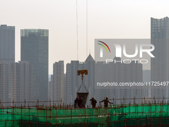 A building under construction by China Overseas Property is for sale in Qingjiangpu district, Huai 'an city, Jiangsu province, on October 31...