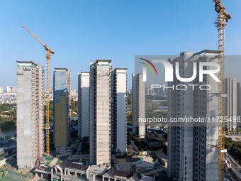 A building under construction by China Overseas Property is for sale in Qingjiangpu district, Huai 'an city, Jiangsu province, on October 31...