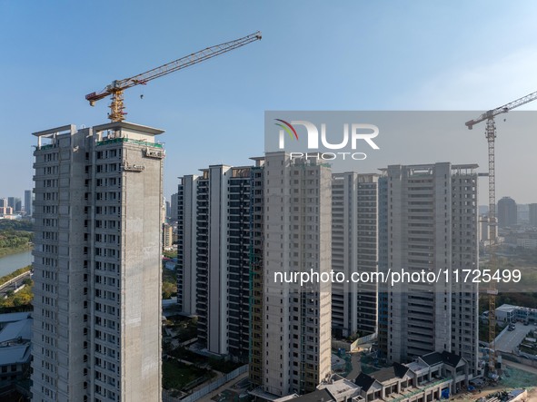 A building under construction by China Overseas Property is for sale in Qingjiangpu district, Huai 'an city, Jiangsu province, on October 31...