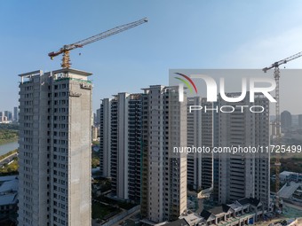 A building under construction by China Overseas Property is for sale in Qingjiangpu district, Huai 'an city, Jiangsu province, on October 31...