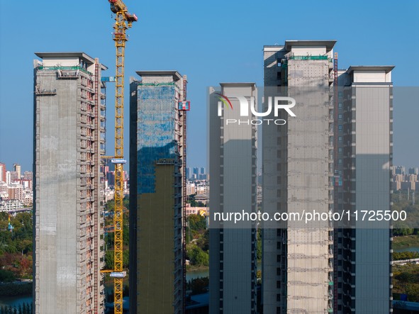 A building under construction by China Overseas Property is for sale in Qingjiangpu district, Huai 'an city, Jiangsu province, on October 31...