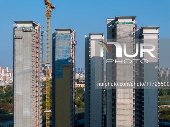 A building under construction by China Overseas Property is for sale in Qingjiangpu district, Huai 'an city, Jiangsu province, on October 31...