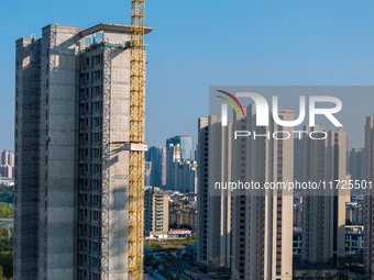 A building under construction by China Overseas Property is for sale in Qingjiangpu district, Huai 'an city, Jiangsu province, on October 31...