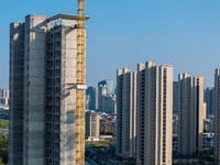 A building under construction by China Overseas Property is for sale in Qingjiangpu district, Huai 'an city, Jiangsu province, on October 31...