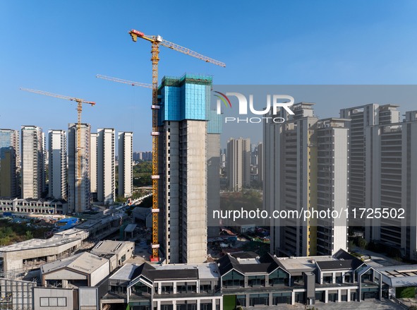 A building under construction by China Overseas Property is for sale in Qingjiangpu district, Huai 'an city, Jiangsu province, on October 31...