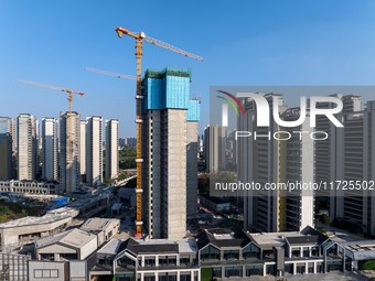 A building under construction by China Overseas Property is for sale in Qingjiangpu district, Huai 'an city, Jiangsu province, on October 31...