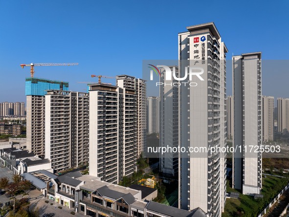 A building under construction by China Overseas Property is for sale in Qingjiangpu district, Huai 'an city, Jiangsu province, on October 31...