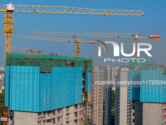 A building under construction by China Overseas Property is for sale in Qingjiangpu district, Huai 'an city, Jiangsu province, on October 31...