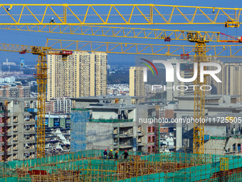 A building under construction by China Overseas Property is for sale in Qingjiangpu district, Huai 'an city, Jiangsu province, on October 31...