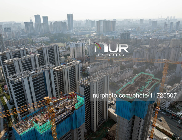 A building under construction by China Overseas Property is for sale in Qingjiangpu district, Huai 'an city, Jiangsu province, on October 31...