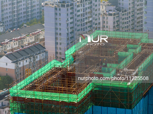 A building under construction by China Overseas Property is for sale in Qingjiangpu district, Huai 'an city, Jiangsu province, on October 31...