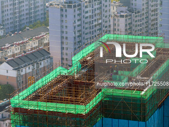 A building under construction by China Overseas Property is for sale in Qingjiangpu district, Huai 'an city, Jiangsu province, on October 31...