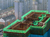 A building under construction by China Overseas Property is for sale in Qingjiangpu district, Huai 'an city, Jiangsu province, on October 31...