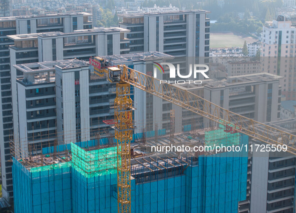 A building under construction by China Overseas Property is for sale in Qingjiangpu district, Huai 'an city, Jiangsu province, on October 31...