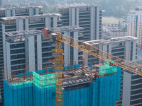 A building under construction by China Overseas Property is for sale in Qingjiangpu district, Huai 'an city, Jiangsu province, on October 31...